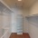 built-in shelving in walk-in closet